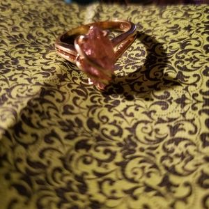 Pink stone ring marked 14k